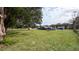 Large backyard with a view of the house at 2405 Se 157Th Lane Rd, Summerfield, FL 34491