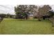 Spacious backyard with large tree and grassy area at 2405 Se 157Th Lane Rd, Summerfield, FL 34491