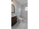 Updated bathroom with walk-in shower, vanity, and toilet at 2405 Se 157Th Lane Rd, Summerfield, FL 34491