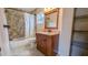 Updated bathroom with tile shower and granite vanity at 2405 Se 157Th Lane Rd, Summerfield, FL 34491