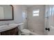 Clean bathroom with updated vanity, toilet and shower at 2405 Se 157Th Lane Rd, Summerfield, FL 34491