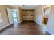 Bedroom with wood floors and rustic accent wall at 2405 Se 157Th Lane Rd, Summerfield, FL 34491