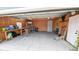 Spacious garage with storage shelves and work bench at 2405 Se 157Th Lane Rd, Summerfield, FL 34491