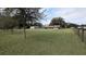 Ranch-style home with attached garage and expansive lawn at 2405 Se 157Th Lane Rd, Summerfield, FL 34491