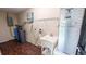 Convenient laundry room with utility sink, water softener, and ample storage at 2405 Se 157Th Lane Rd, Summerfield, FL 34491