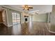 Living room with stone fireplace and sliding glass doors at 2405 Se 157Th Lane Rd, Summerfield, FL 34491