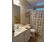 Bathroom with white vanity and ocean-themed decor at 250 Joanne Dr, Davenport, FL 33897