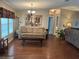 Living room with hardwood floors, couches, and a coffee table at 250 Joanne Dr, Davenport, FL 33897