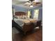 Main bedroom with king-size bed, hardwood floors and ceiling fan at 250 Joanne Dr, Davenport, FL 33897