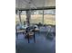 Relaxing screened porch with table and rocking chair at 250 Joanne Dr, Davenport, FL 33897