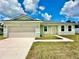 New construction home featuring a light green exterior and two-car garage at 2645 Sw 155Th Ln, Ocala, FL 34473