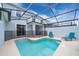 Enjoy this refreshing pool with a screened enclosure and patio furniture at 2992 Protagonist St, Kissimmee, FL 34746