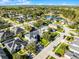 High angle view showcases a tranquil residential street with well-maintained homes and lush greenery. Solar panels are installed at 3063 Juneberry Ter, Oviedo, FL 32766