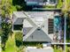 An aerial view of the home's roof, pool, spa, and the solar panels at 3063 Juneberry Ter, Oviedo, FL 32766