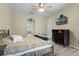 Main bedroom with a dresser and a TV, offering an ensuite bathroom at 3063 Juneberry Ter, Oviedo, FL 32766