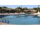 Large community pool with plenty of seating and umbrellas at 3063 Juneberry Ter, Oviedo, FL 32766