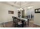 Bright dining room with hardwood floors, a glass-top table, and tasteful decor at 3063 Juneberry Ter, Oviedo, FL 32766