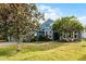 Curb appeal abounds with this lovely blue home and gorgeous landscaping at 3063 Juneberry Ter, Oviedo, FL 32766