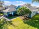 Charming blue home with a well-manicured lawn and mature landscaping at 3063 Juneberry Ter, Oviedo, FL 32766