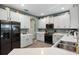 Modern kitchen with stainless steel appliances and white cabinets at 3063 Juneberry Ter, Oviedo, FL 32766