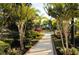 Walkway leading to community pool with lush landscaping at 3063 Juneberry Ter, Oviedo, FL 32766