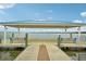 Relaxing dockside shelter with benches overlooking the lake at 33431 Seattle Slew Dr, Sorrento, FL 32776