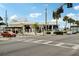 Street view showcasing a charming corner building with shops at 33431 Seattle Slew Dr, Sorrento, FL 32776