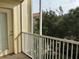 Screened balcony overlooking trees and other buildings at 3344 Robert Trent Jones Dr # 30505, Orlando, FL 32835