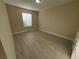 Bright bedroom with wood-look floors at 3344 Robert Trent Jones Dr # 30505, Orlando, FL 32835