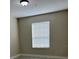 Simple bedroom with window blinds and neutral walls at 3344 Robert Trent Jones Dr # 30505, Orlando, FL 32835