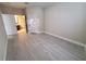 Bedroom with wood-look floors and bathroom access at 3344 Robert Trent Jones Dr # 30505, Orlando, FL 32835