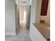 Light-filled hallway with wood-look flooring and neutral walls at 3344 Robert Trent Jones Dr # 30505, Orlando, FL 32835