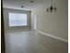 Bright living room with large window and neutral color palette at 3344 Robert Trent Jones Dr # 30505, Orlando, FL 32835