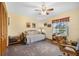 Bright bedroom with a daybed, seating, and ample natural light at 4960 Se 37Th Ct, Ocala, FL 34480