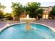 Tranquil fountain in the center of a paved courtyard at 501 Mirasol Cir # 306, Celebration, FL 34747