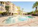 Relaxing resort-style pool with plenty of lounge chairs at 501 Mirasol Cir # 306, Celebration, FL 34747