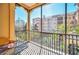 Relaxing screened balcony with table and chairs, overlooking courtyard at 501 Mirasol Cir # 306, Celebration, FL 34747