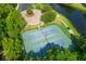 Two well-maintained tennis courts with surrounding green space at 501 Mirasol Cir # 306, Celebration, FL 34747