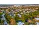 Expansive aerial view of community showcasing lush landscaping, winding roads and ample parking at 5368 Elm Ct # 354, Orlando, FL 32811