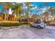 Exterior of home with lush landscaping and designated parking spaces at 5368 Elm Ct # 354, Orlando, FL 32811