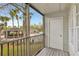 Screened-in balcony with views of the community pool and landscaped grounds at 6034 Westgate Dr # 202, Orlando, FL 32835