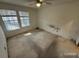 Large carpeted bedroom with ample natural light at 6034 Westgate Dr # 202, Orlando, FL 32835