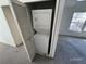 Stackable washer and dryer in closet at 6034 Westgate Dr # 202, Orlando, FL 32835