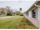 Side view of a well-maintained single-story home with tidy landscaping at 611 Bay Ave, Holly Hill, FL 32117