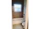 Bathroom with shower/tub combo and granite countertop at 615 N Delmonte Ct, Kissimmee, FL 34758