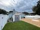 Private backyard oasis with a pool, shed, and dog house at 6642 Matchett Rd, Orlando, FL 32809