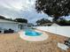 Inviting kidney-shaped pool with a pebble-tec finish and a fenced backyard at 6642 Matchett Rd, Orlando, FL 32809