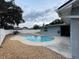 Refreshing blue pool with a concrete patio and fenced backyard at 6642 Matchett Rd, Orlando, FL 32809