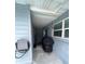 Covered side patio with grill and plenty of storage space at 6642 Matchett Rd, Orlando, FL 32809