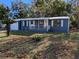 Cute ranch-style home with gray siding and white trim at 6952 Sw 85Th Pl, Ocala, FL 34476